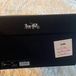 Coach brown logo leather sneakers .  Brand New.  Never even tried on.